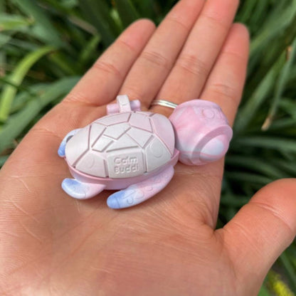 Person holding a Calm Buddi Turtle anxiety-relief fidget toy in Cloud