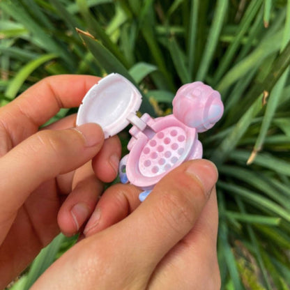 Person using an open Calm Buddi Turtle calming fidget toy in Cloud