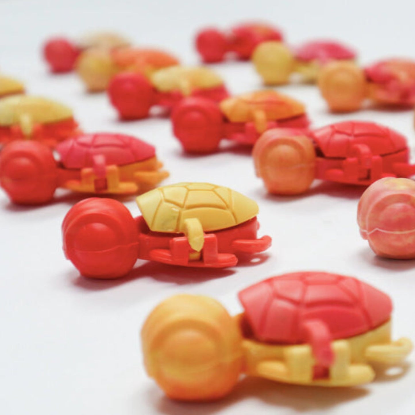 Colour variety of the Calm Buddi Turtle calming fidget toy in Lava