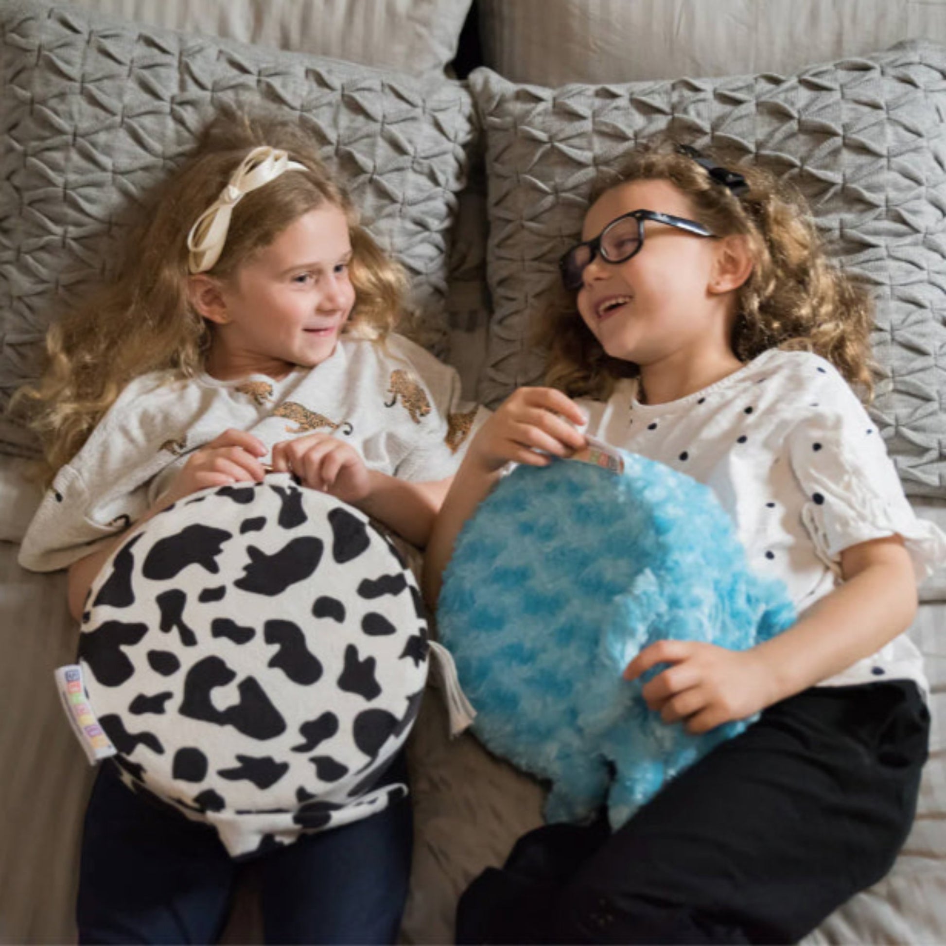 Children using the Senseez Vibrating Cushion, Touchables in the Furry Cow and Jelly Plush designs