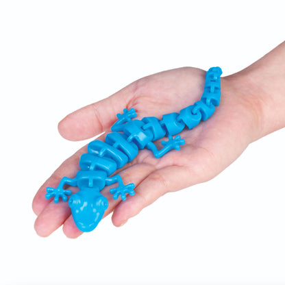 Hand holding a Sensory Gecko Fidget Articulated ASMR in Blue