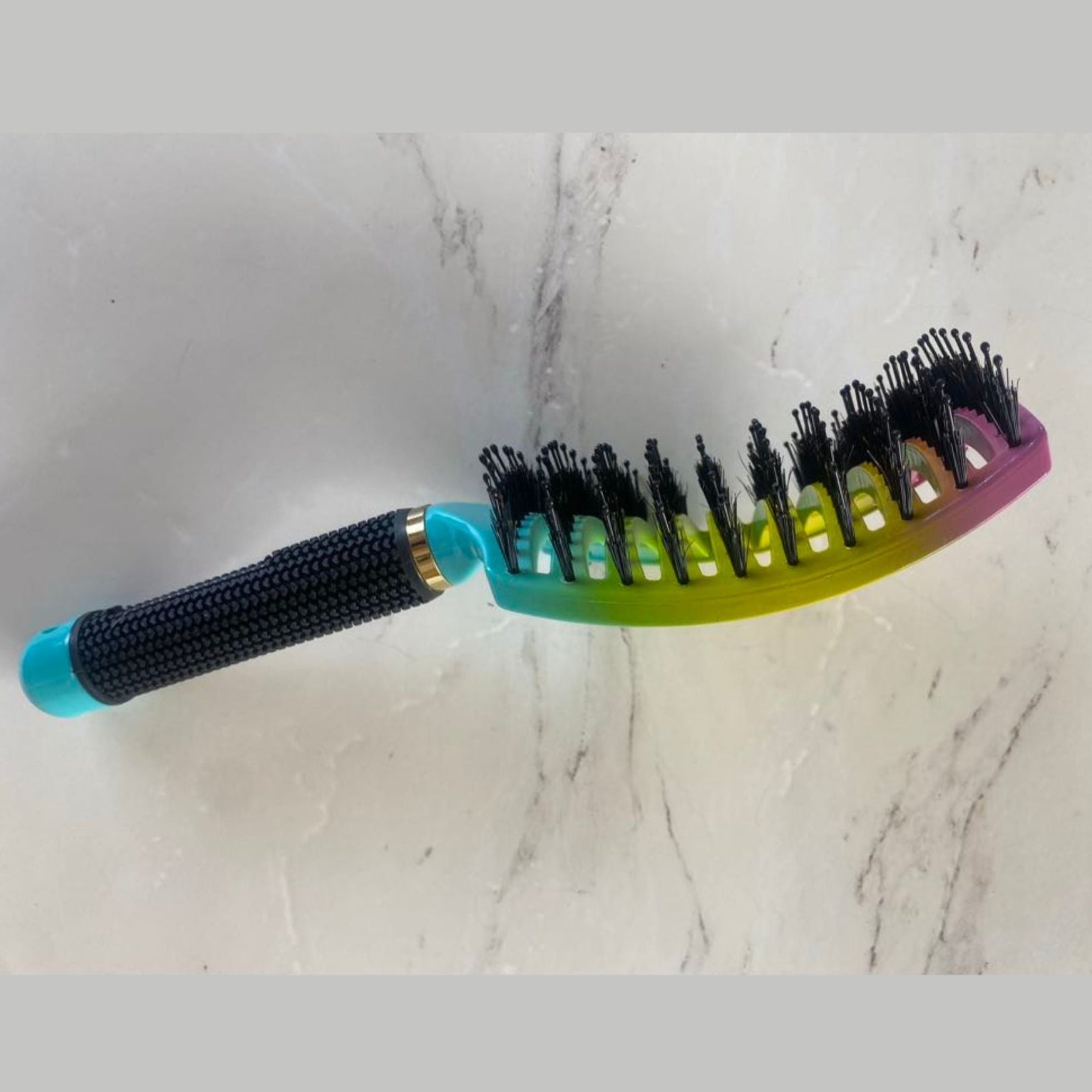 Side view of a Sensory Smoother Hairbrush in Rainbow