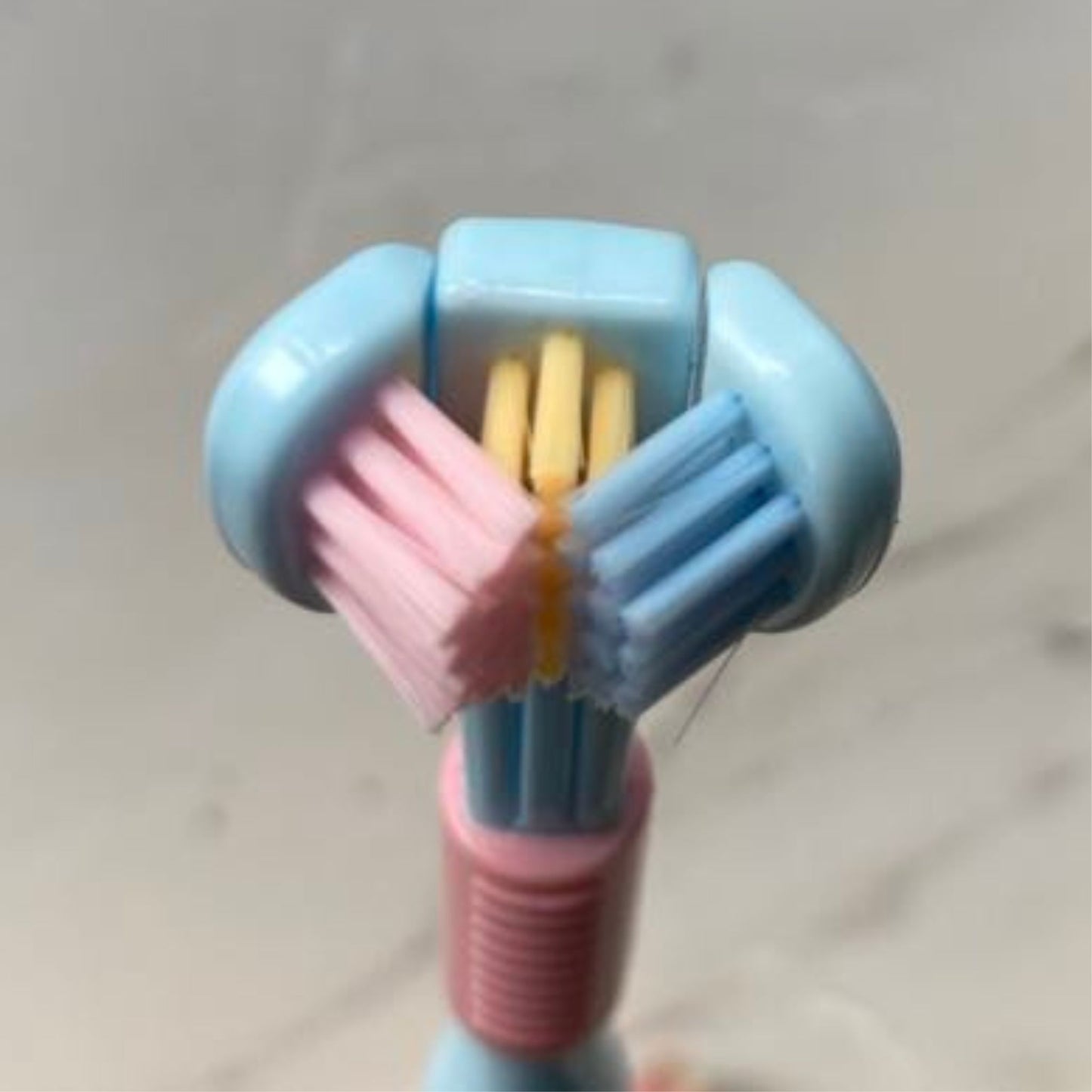 Close up of Tri-sided Sensory Toothbrush head in Blue