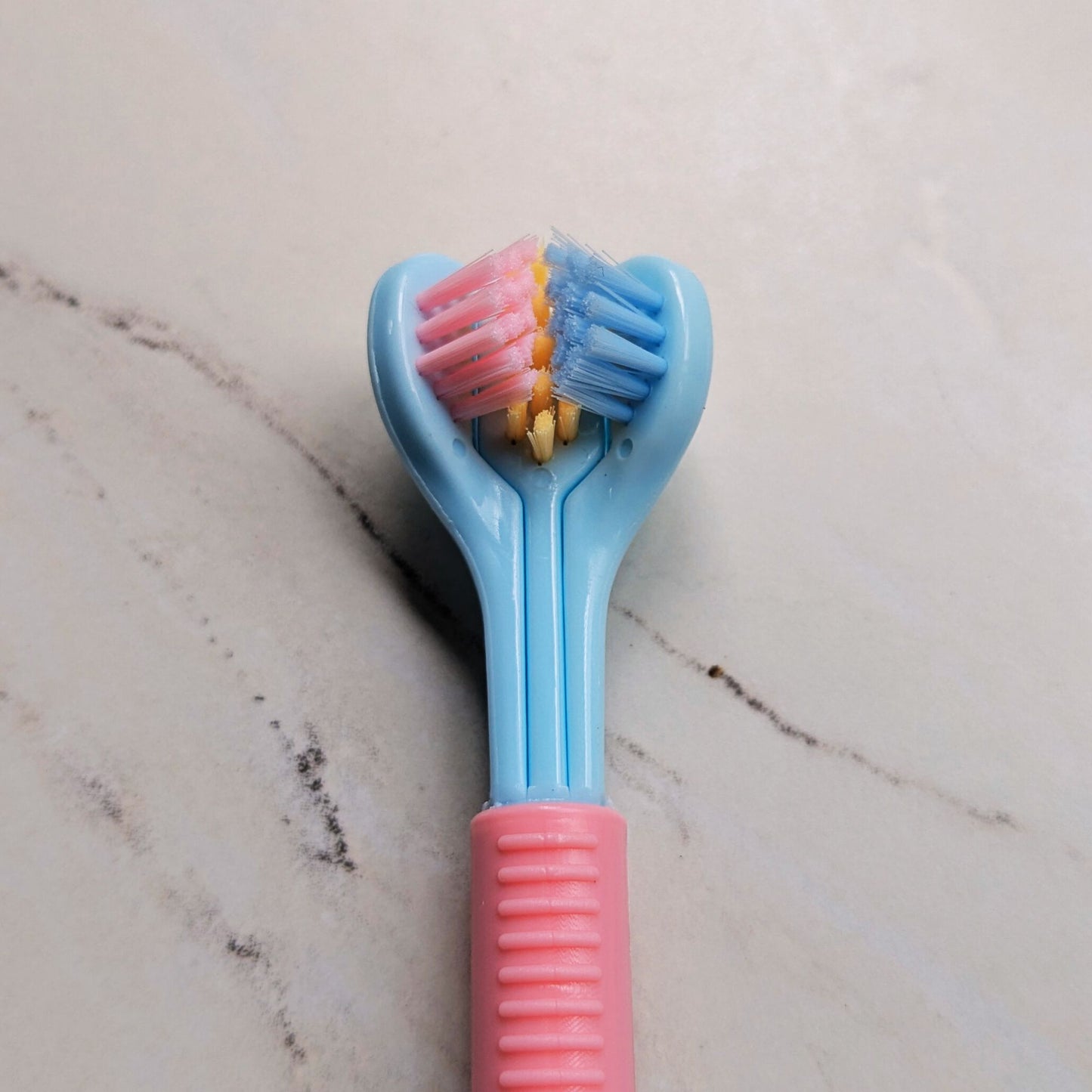 Close up of Tri-sided Sensory Toothbrush head in Blue