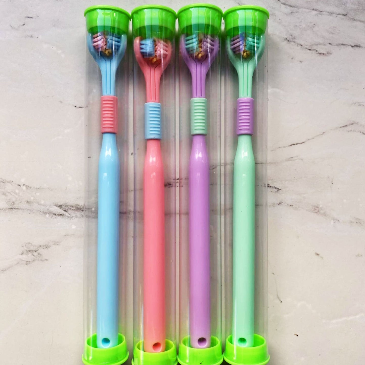 Four Tri-Sided Sensory Toothbrushes in tubes - Blue, Pink, Purple, Green